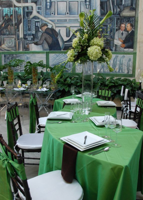 Dinnerware and green table linens for event at Detroit Institute of Arts