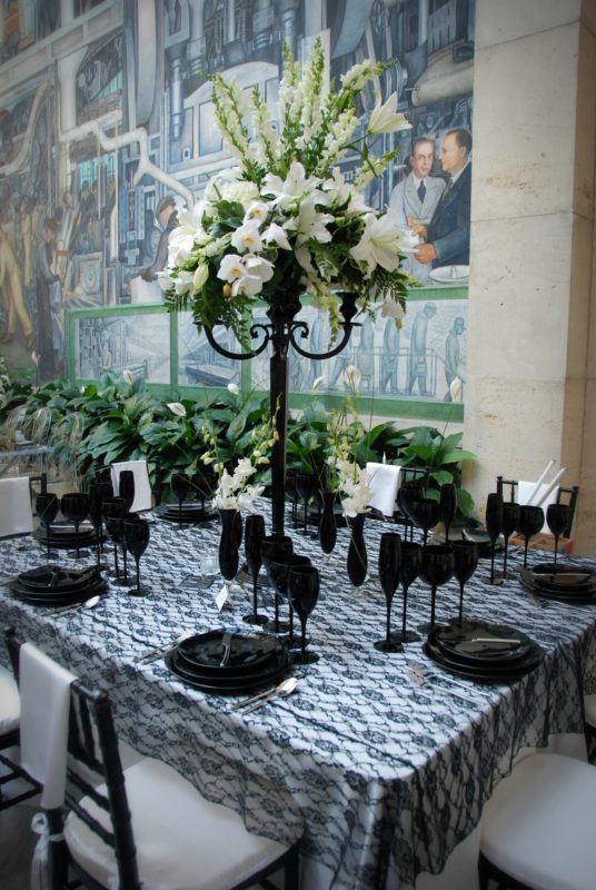 Banquet table with tall floral centerpiece for event at Detroit Institute of Arts