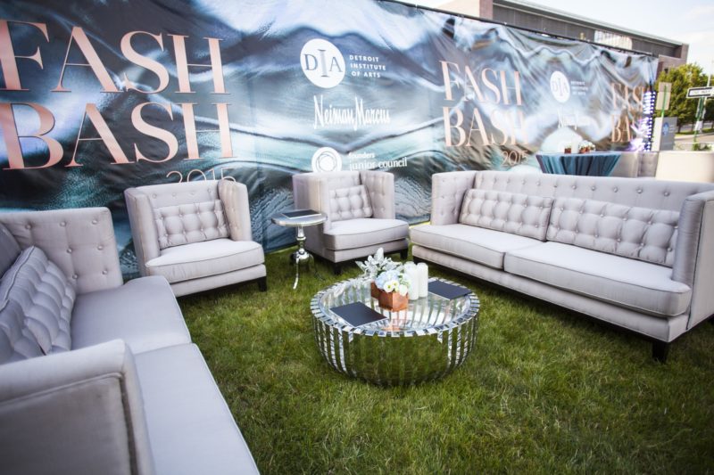 Outdoor couches and table at corporate event.