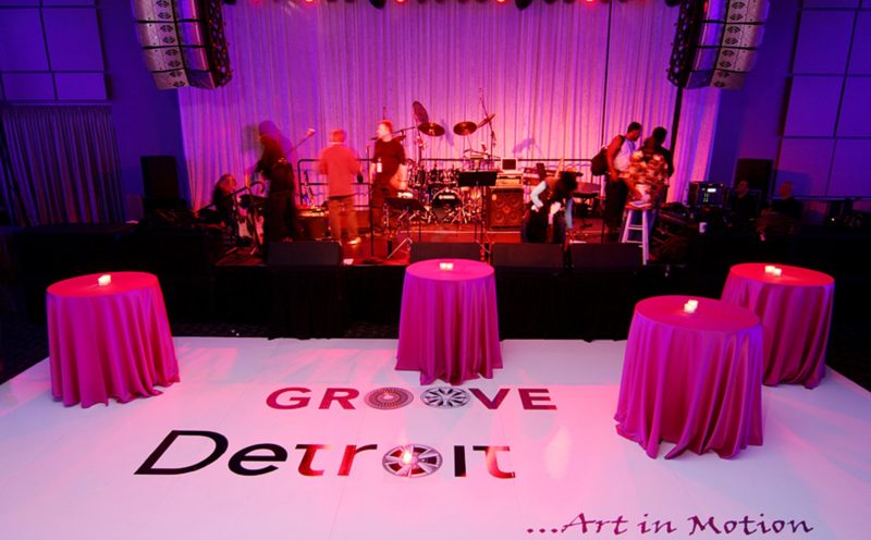 Band playing on stage for event in Detroit