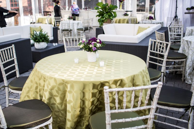 Gold table linens for event at Henry Ford Glass House in Michigan