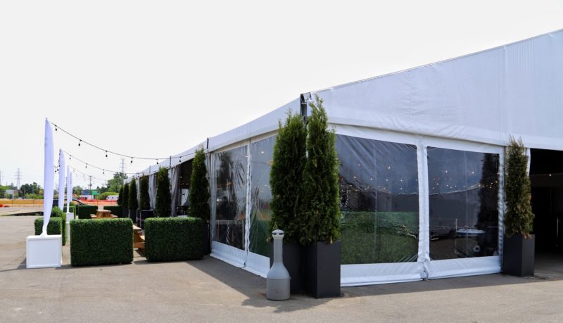 Tent with walls for an outdoor event.