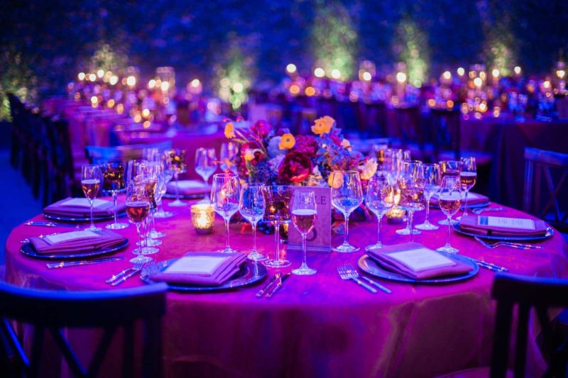 Dinnerware and glassware with pink tablecloth for event in Michigan