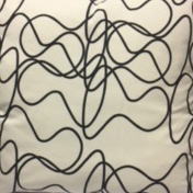 Black Squiggle On White Pillow